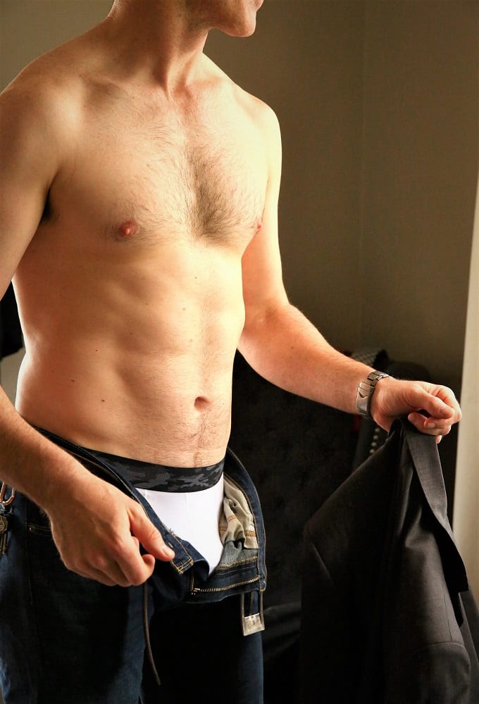 Photo of Harley Brixton male escort's body, pants unzipped.
